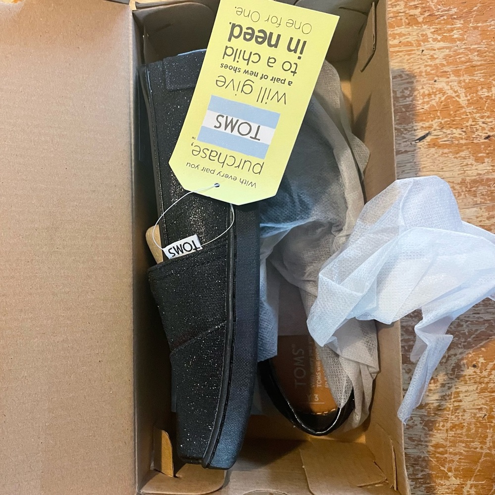 Brand new with tags glitter black kids size 3 toms.